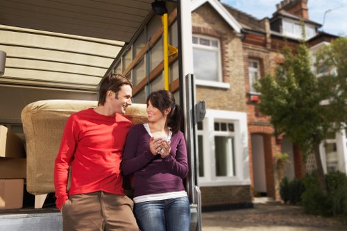 Local removals team handling boxes and furniture in Haringey