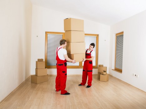 Packed office boxes and furniture ready for relocation