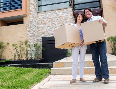 Packed moving boxes and furniture for a Haringey house move